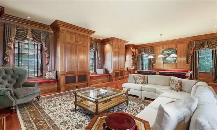 Library with Woodburning Fireplace and 10' Ceiling. Brunswick Pool Table Included. French Door Opens to Bluestone Patio.