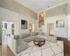 Bright Inviting Family Room with Four Sets of French Doors Open to Bluestone Patio and 15' Ceiling Connecting to Kitchen, Breakfast Room and Back Hall.Virtually Staged.