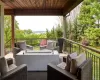 Outdoor living room with stairs to patio pool and garden