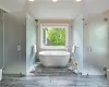 Luxurious primary en-suite bathroom with 2 Duravit vanities and heated floor