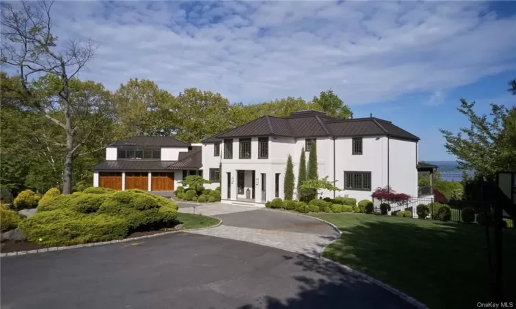 Private circular driveway and a 3 car garage.