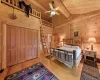 Bedroom with beamed ceiling, light wood-type flooring, and wooden ceiling