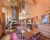 Dining room featuring beam ceiling, hardwood / wood-style floors, and rustic walls