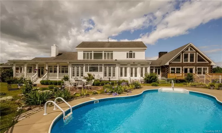 Rear view of property with a patio