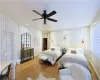 Bedroom featuring hardwood / wood-flooring and ceiling fan