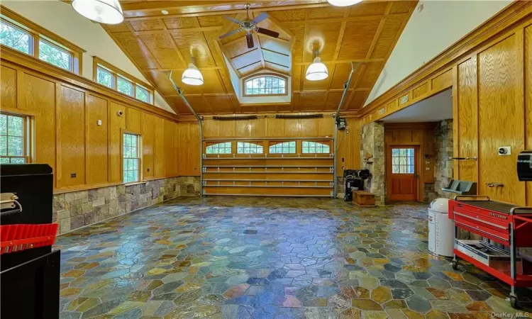 garage/flex space with beautiful stone floors