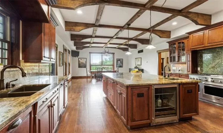 Oversized Kitchen with high ceilings and stunning views looking over the pool