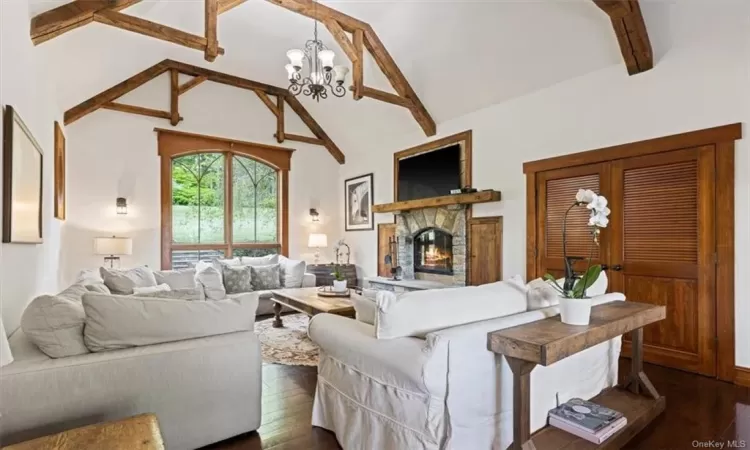 Living Room with fireplace and hand sewn beams