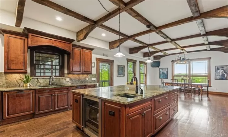 Additional sink and Fridge, main sink flanked by double dishwashers