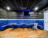 Recreation room with bar area and hardwood / wood-style flooring