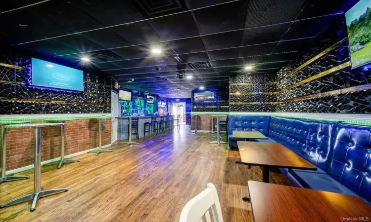 Recreation room featuring hardwood / wood-style floors