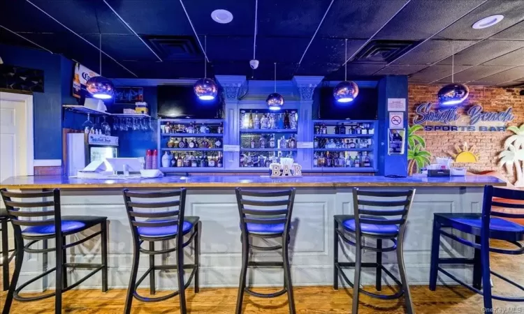 Bar featuring a paneled ceiling