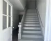 Stairway featuring wood-type flooring