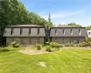 View of front of property with a front lawn