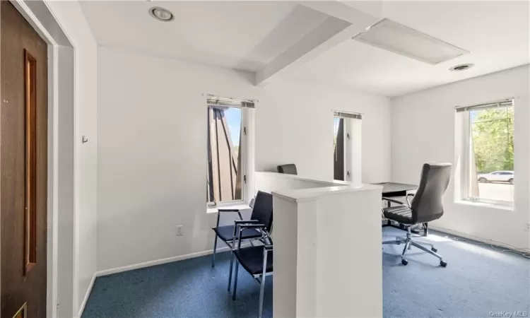 Office with beam ceiling