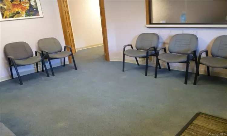 Sitting room with carpet floors