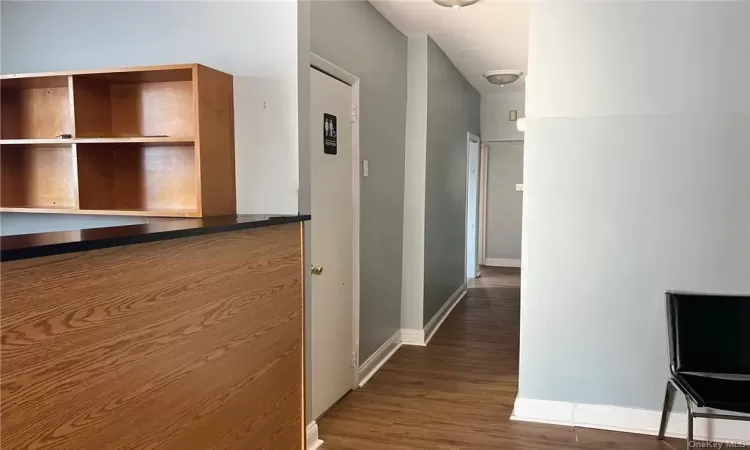 Corridor with dark wood-type flooring