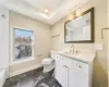 Full bathroom featuring shower / tub combination, tile floors, vanity, and toilet