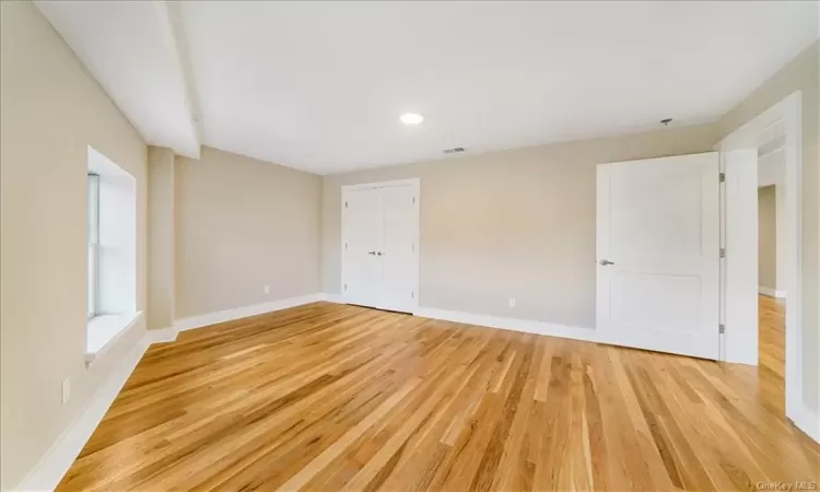 Spare room featuring light hardwood / wood-style flooring