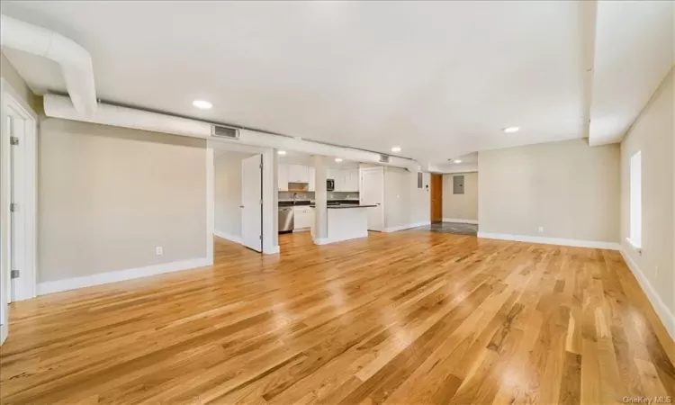 Unfurnished living room featuring light hardwood / wood-style floors