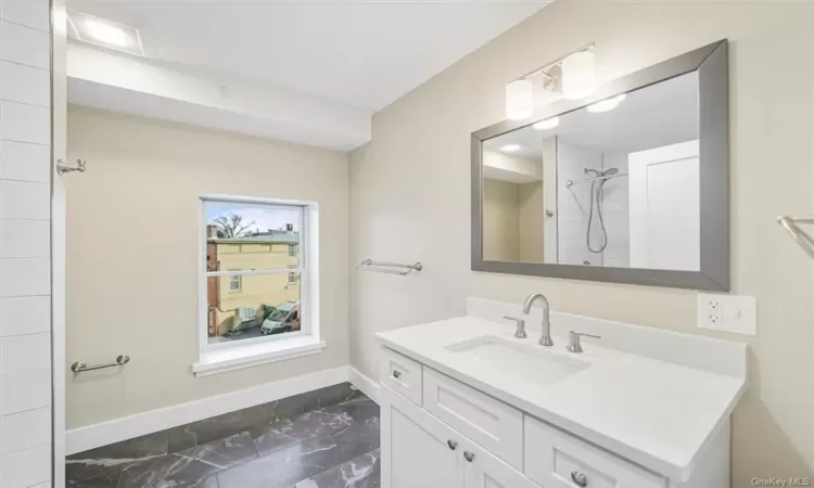 Bathroom with tile floors and vanity