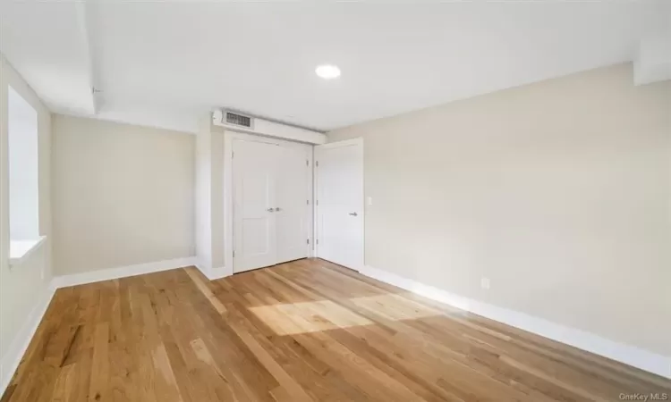 Room with light hardwood / wood-style floors