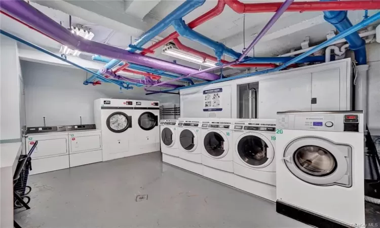 Washroom featuring independent washer and dryer