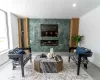 Living room with a wealth of natural light and tile floors