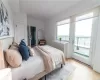 Bedroom with light hardwood / wood-style flooring and access to outside