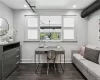 Living room with dark wood-type flooring