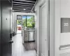 Kitchen with dark hardwood / wood-style floors and dishwasher