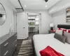 Bedroom featuring dark hardwood / wood-style flooring