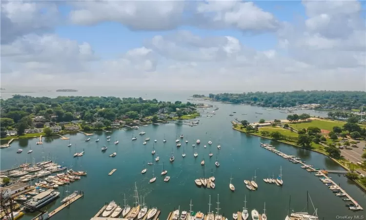 Birds eye view of property with a water view