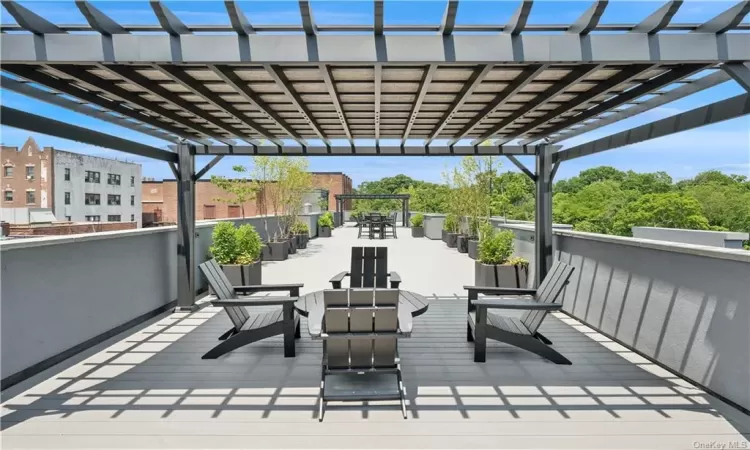 Wooden terrace featuring a pergola