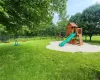 View of jungle gym with a yard