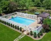 View of swimming pool featuring a patio, a gazebo, and a lawn