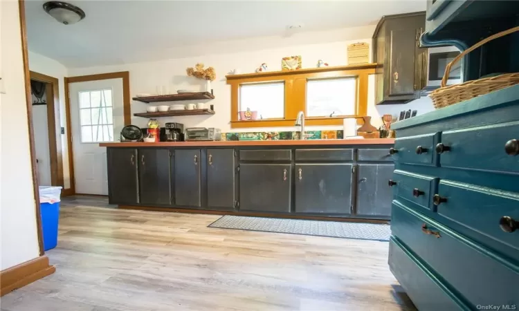 Kitchen with sink and light wood-type flooring