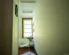 Corridor featuring hardwood / wood-style floors