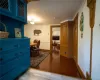 Hall featuring ornamental molding and wood-type flooring