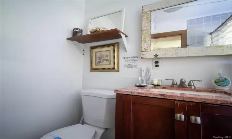 Bathroom featuring toilet and vanity