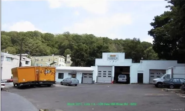 View of building exterior with a garage