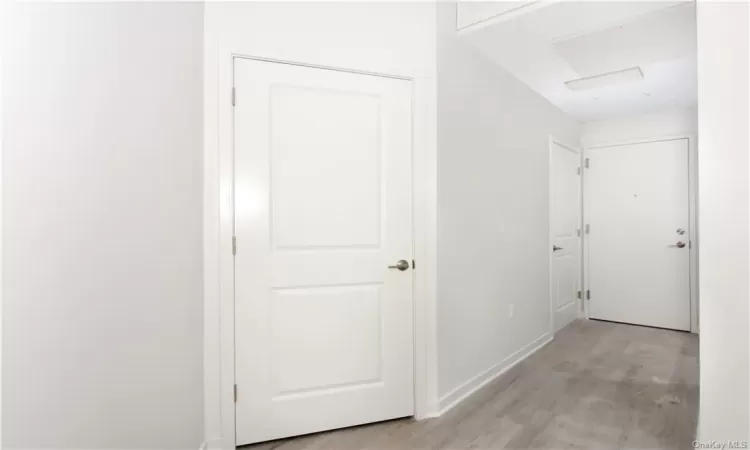 Corridor featuring light hardwood / wood-style flooring