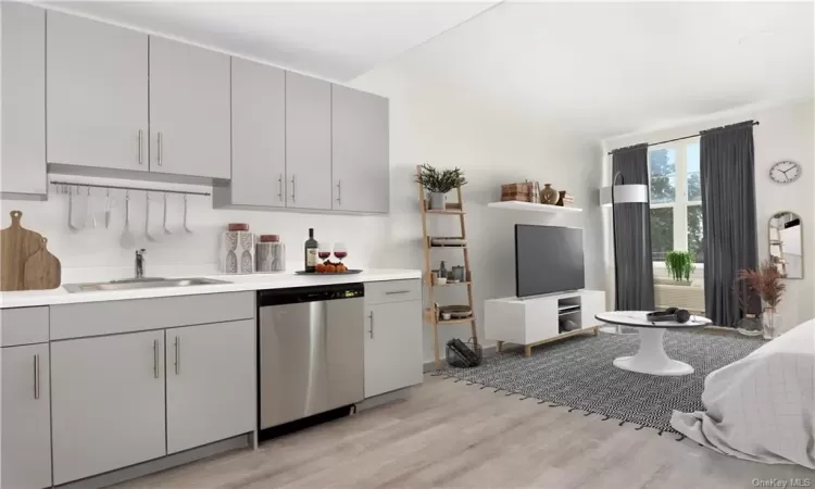 Kitchen with dishwasher, gray cabinetry, sink, and light hardwood / wood-style floors