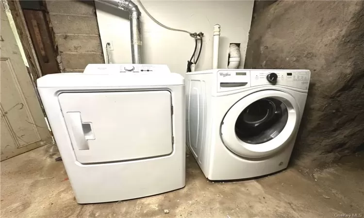 Clothes washing area with hookup for a washing machine and washer and dryer