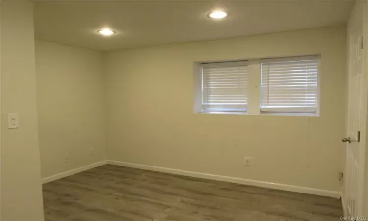 Empty room featuring wood-type flooring