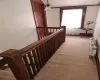 Staircase featuring carpet flooring