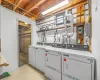 Laundry area featuring separate washer and dryer and light tile floors