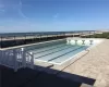 View of swimming pool featuring a water view