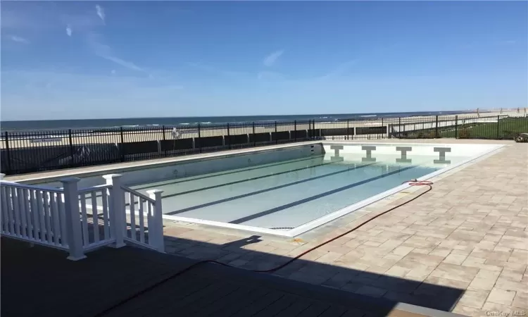 View of swimming pool featuring a water view