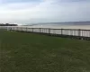 View of yard featuring a view of the beach and a water view